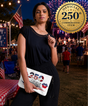 Woman holding a mini leather crossbody purse with 250 years commemorative design at an outdoor event