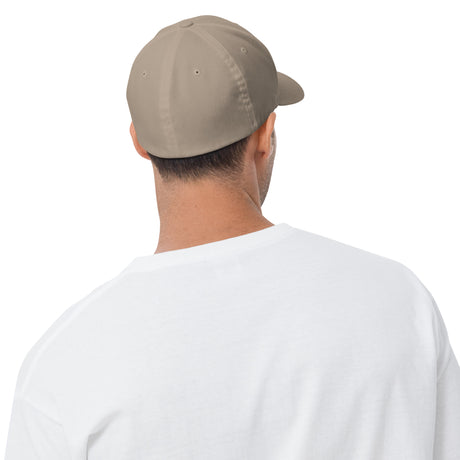 Back view of a man wearing a beige united states of america hat with a white shirt